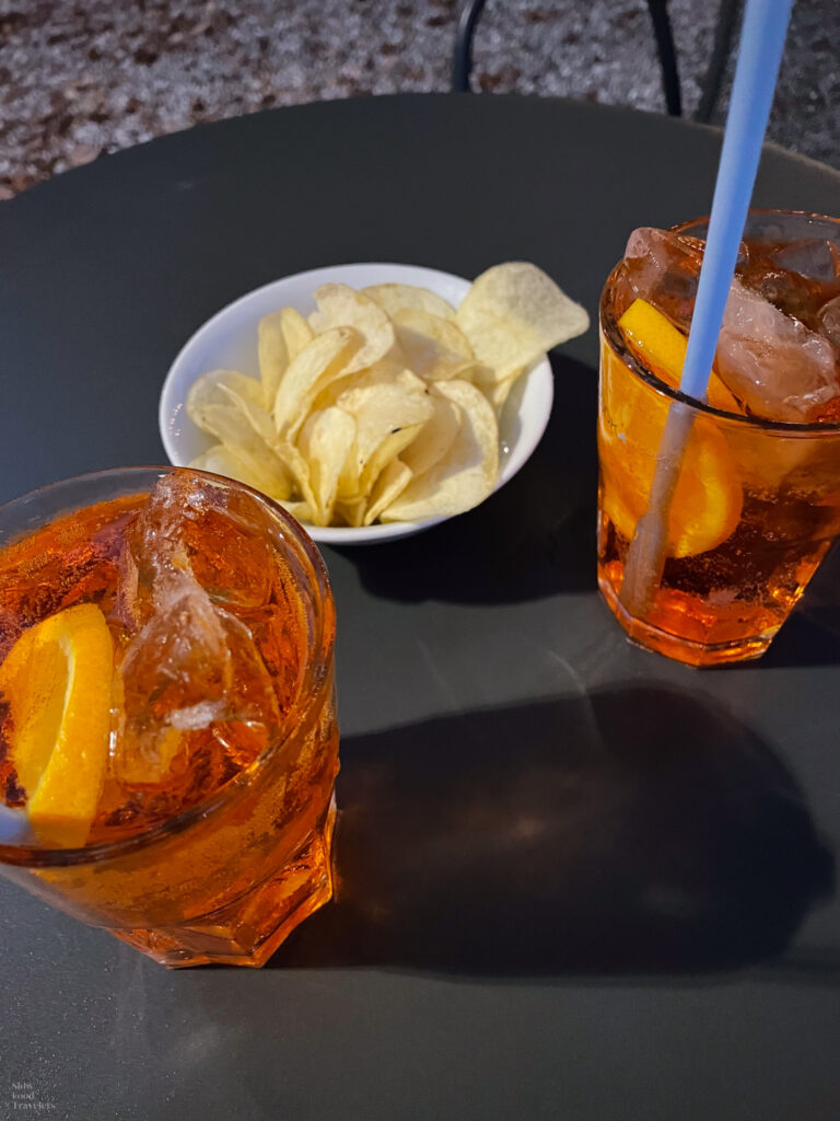 Aperol spritz and chips during aperitivo