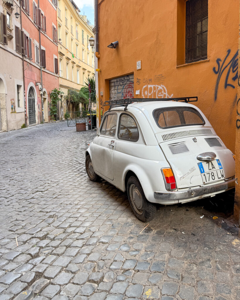 White Fiat on a street in Trastevere